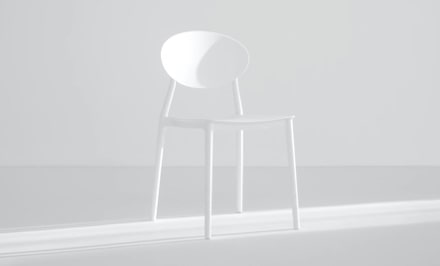 white room with a tall white chair